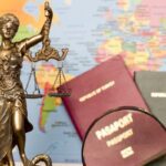What Happens if You Commit a Crime in Another Country | Schaffer Kennedy Johnson Law concept, statue, magnifying glass, passport and world map.