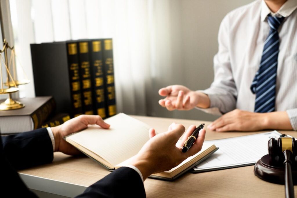 The lawyer and client discuss the lawsuit