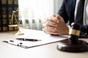 The lawyers sitting in their office is meticulously examining the judicial documents