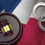 White-Collar Crime | Schaffer Kennedy Johnson Texas US state flag with judge mallet and handcuffs in dark room.