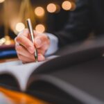Why You Need a Houston-Based Attorney for Federal White-Collar Charges | Schaffer Kennedy Johnson businessmen's hand putting signing contract or agreement form, Lawyers or attorneys